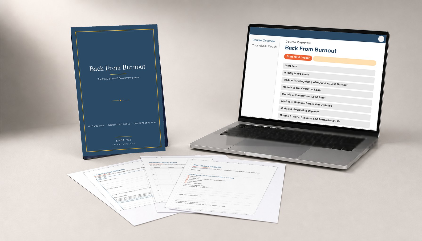 The Back From Burnout programme: the navy printed workbook, the online course open on a laptop showing the module list, and three printable tool sheets fanned in front
