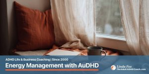 Blog post: Energy Management with AuDHD — a quiet window seat with a soft blanket and a warm mug, representing the recovery time AuDHD brains need to plan for