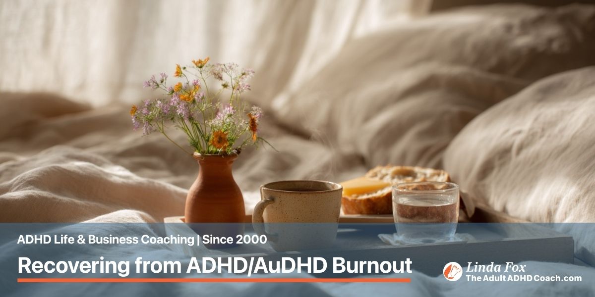 Blog post: Recovering from Burnout with ADHD/AuDHD — a simple breakfast tray in soft morning light with a cup of tea and small flowers, representing the quiet steady work of recovery