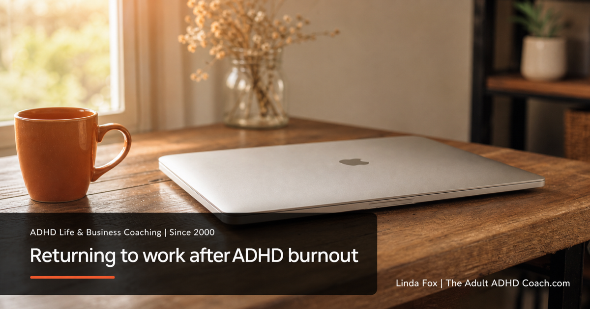 Returning to work after ADHD burnout — closed silver MacBook on a quiet home desk with a terracotta-orange ceramic mug, soft morning light. Gentle, easing back into work.