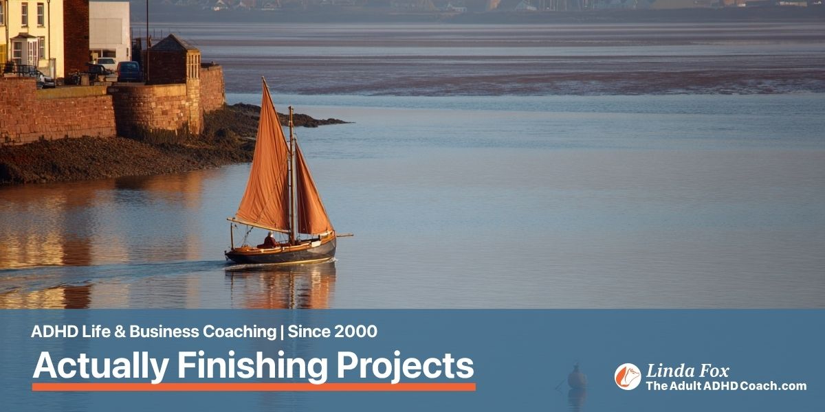 Blog post: The ADHD Entrepreneur's Guide to Actually Finishing Projects — a sailing boat approaching a quiet harbour, representing reaching the finish line