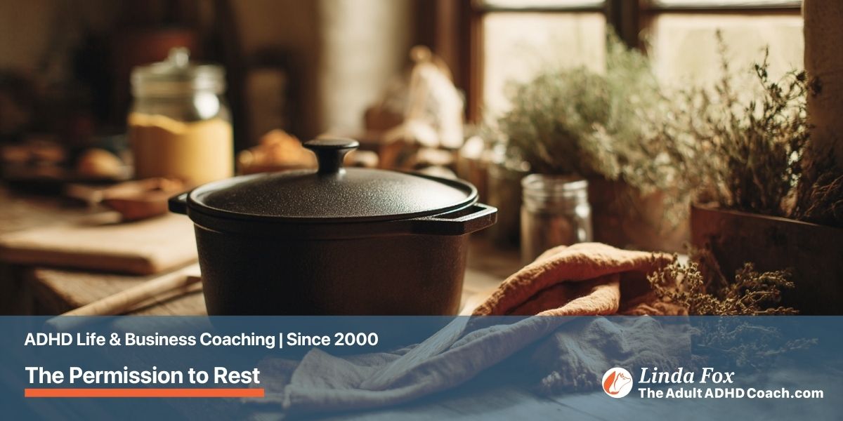 Blog post: The Permission to Rest You Did Not Know You Needed — a cast iron pot simmering gently on a kitchen counter with herbs nearby, representing pottering and slow rest