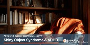 Several leather notebooks on a walnut desk. One orange notebook stands out prominently among muted browns and blacks.