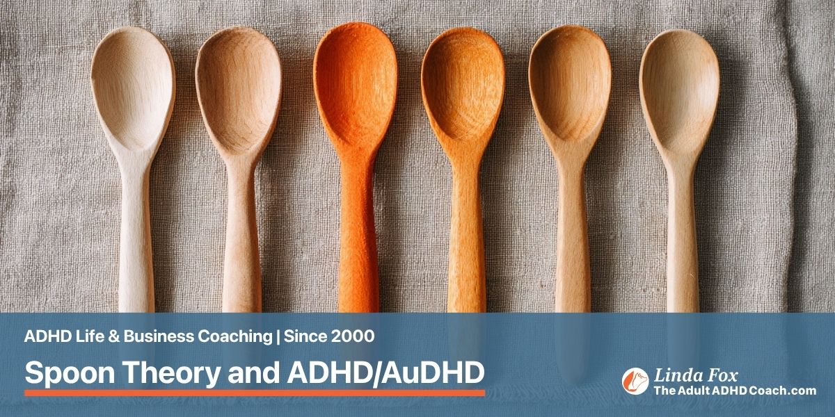 Blog post: Spoon Theory and ADHD/AuDHD — a row of wooden spoons laid on linen with one subtly stained orange, representing a day's supply of energy spoons