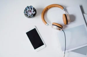Podcast microphone and headphones on a desk
