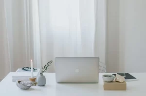 Person working at a laptop in a bright office